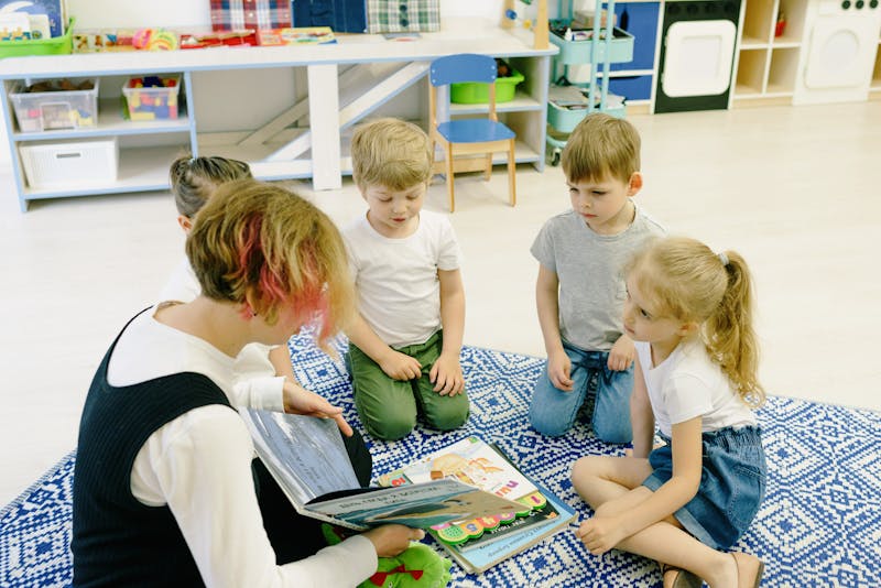 Children reading together on the classroom floor
